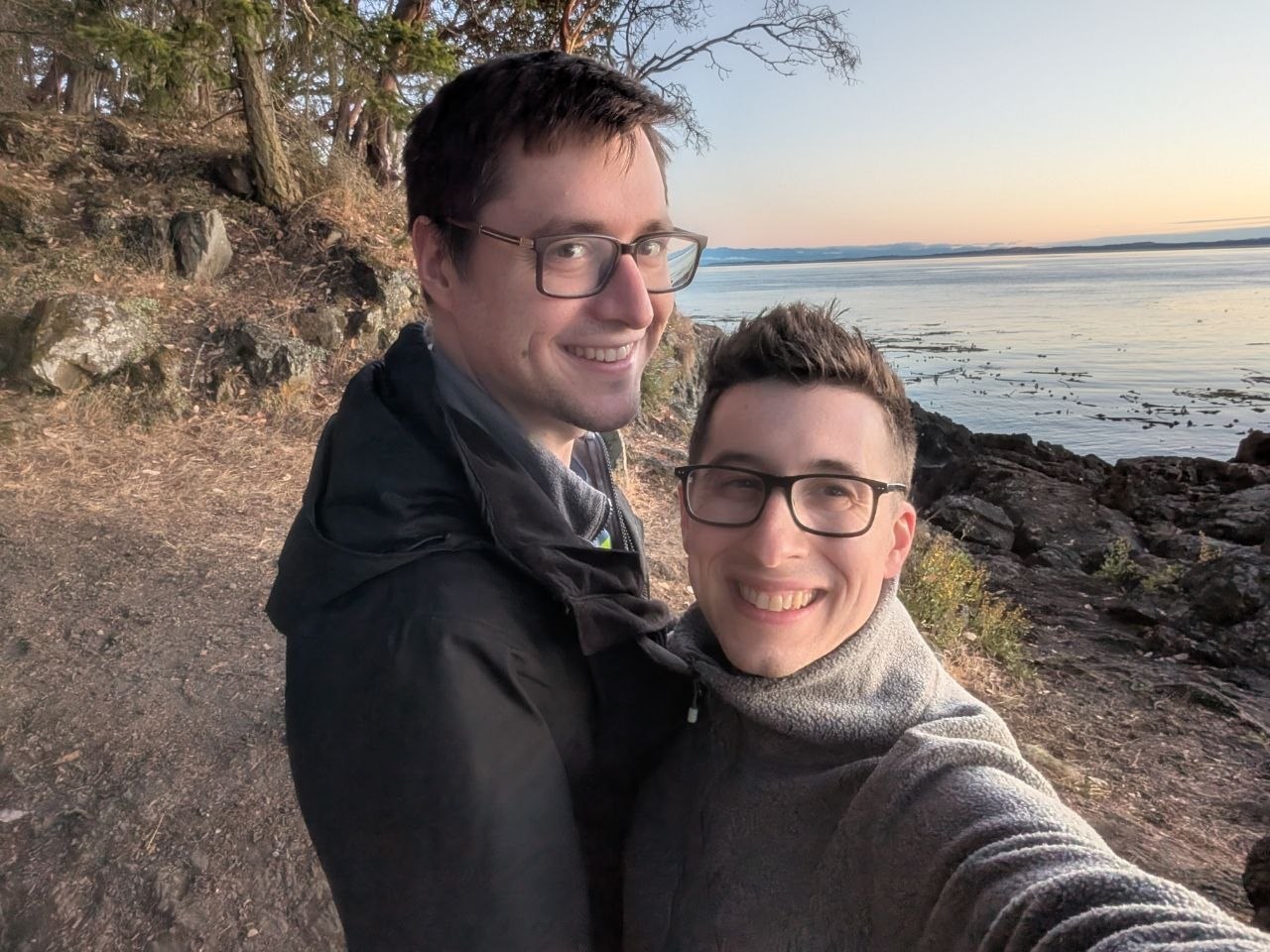 Aaron and Peter on a wooded shoreline